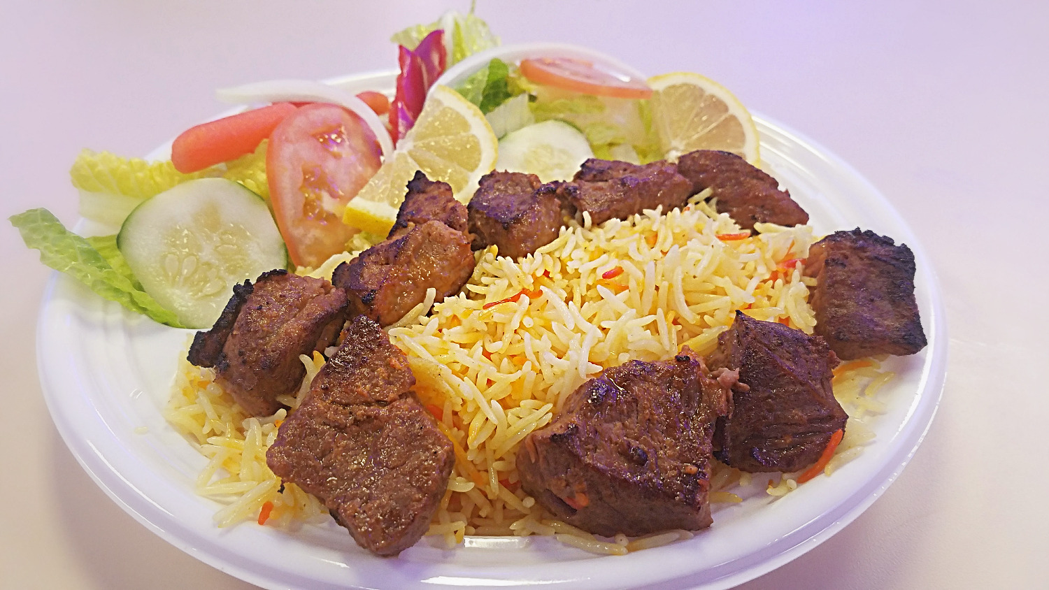 Halal Steak Tikka and Saffron Basmati prepared and sold at Crown Fried Chicken. A halal restaurant in Portland Maine